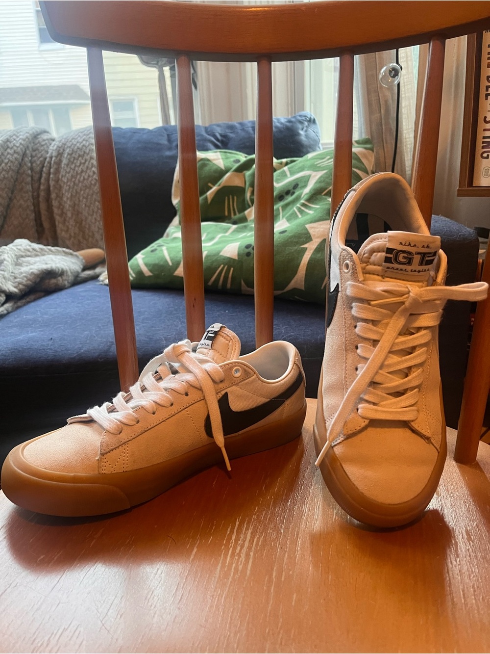 Nike Women's Low-Top Sneakers in Cream with Black Swoosh